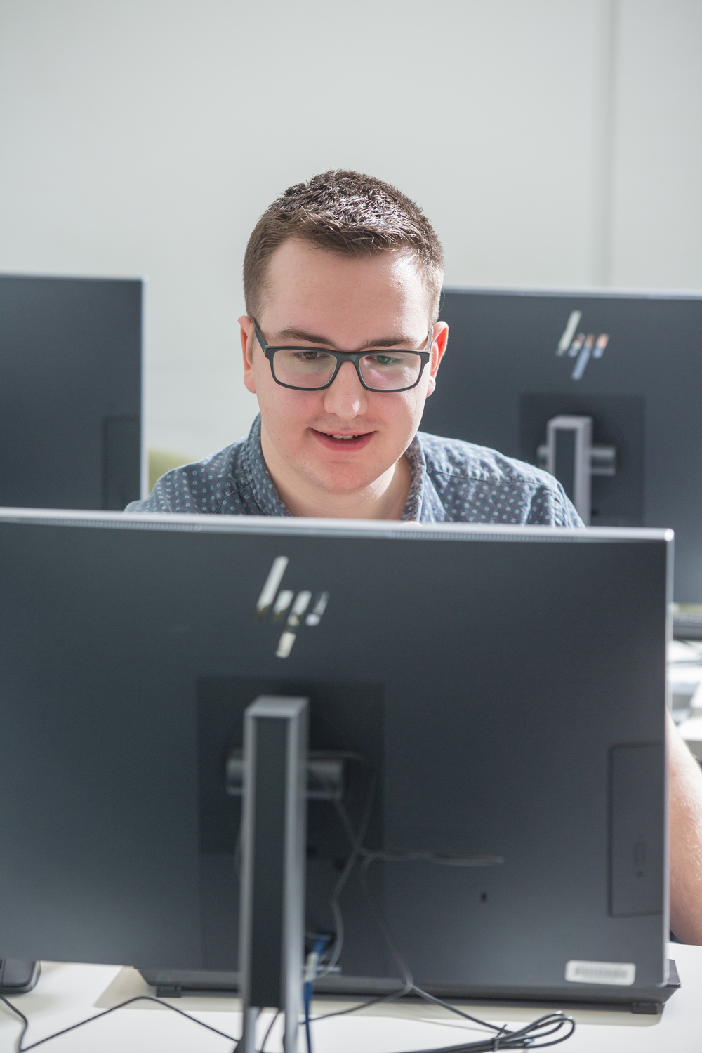 Tom working at a computer