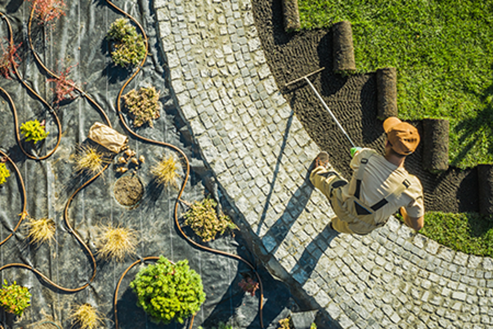 landscaper tending to garden