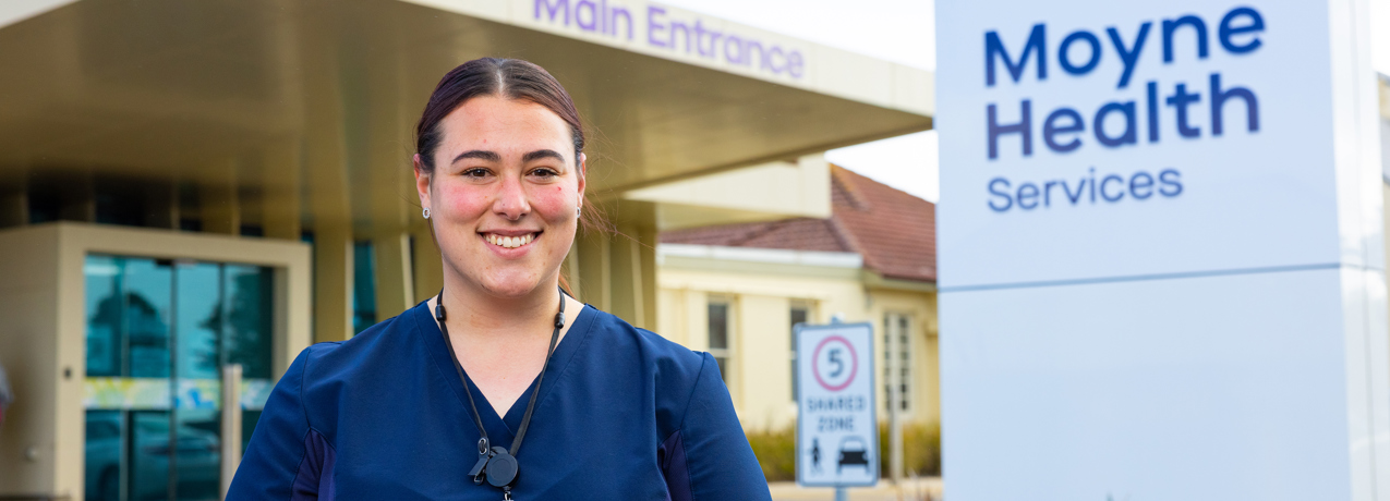 SWTAFE graduate Laura in front of Moyne Health Clinic