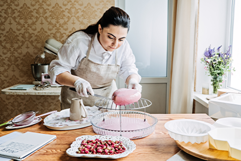 Pastry chef working on a cake